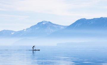 A paddleboarder goes for a morning cruise around the shore of Tahoe City. Lake Tahoe is a high alpine lake located in the Sierra Nevada Mountains, California.
1371032025