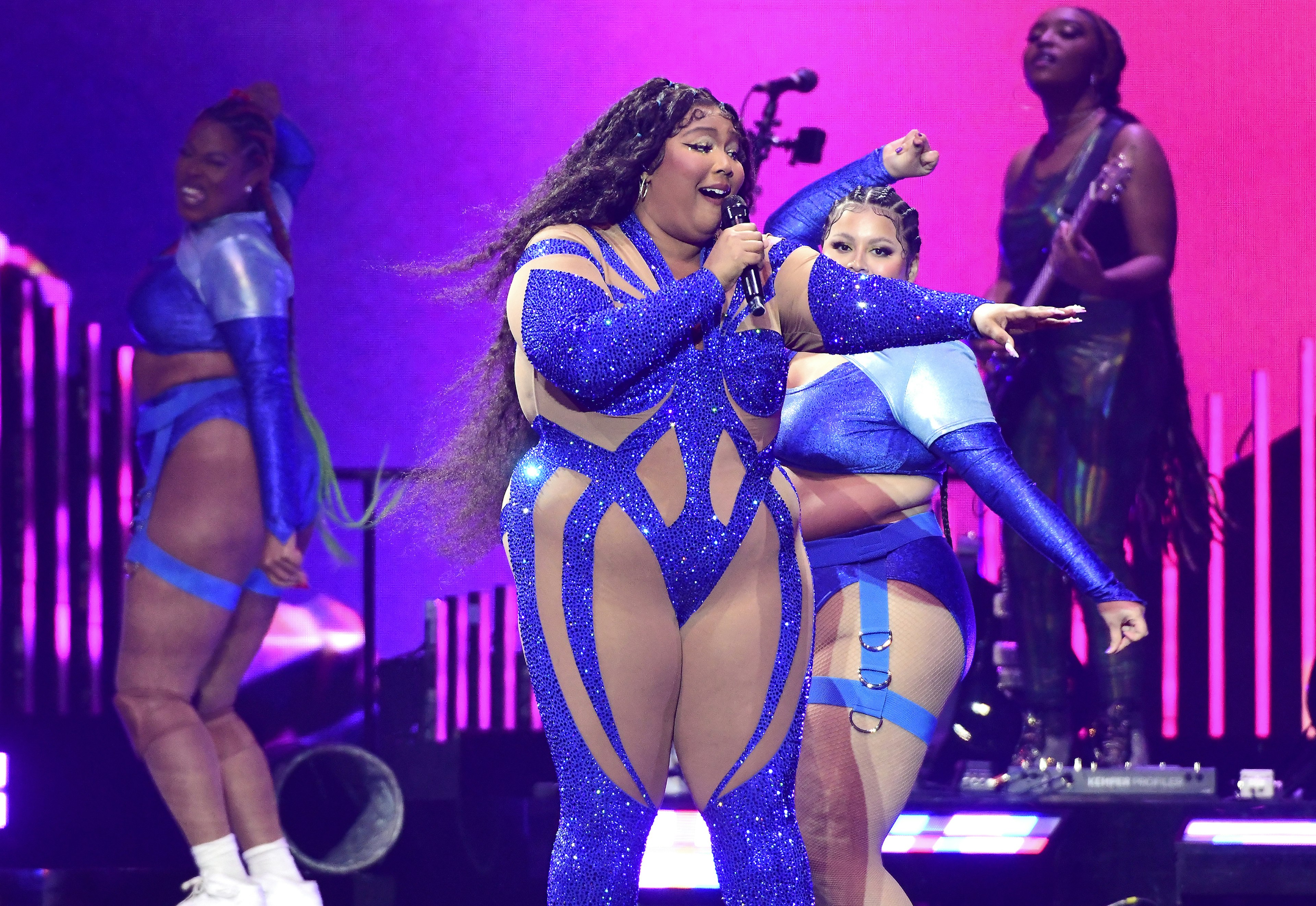 Lizzo performs onstage during her concert