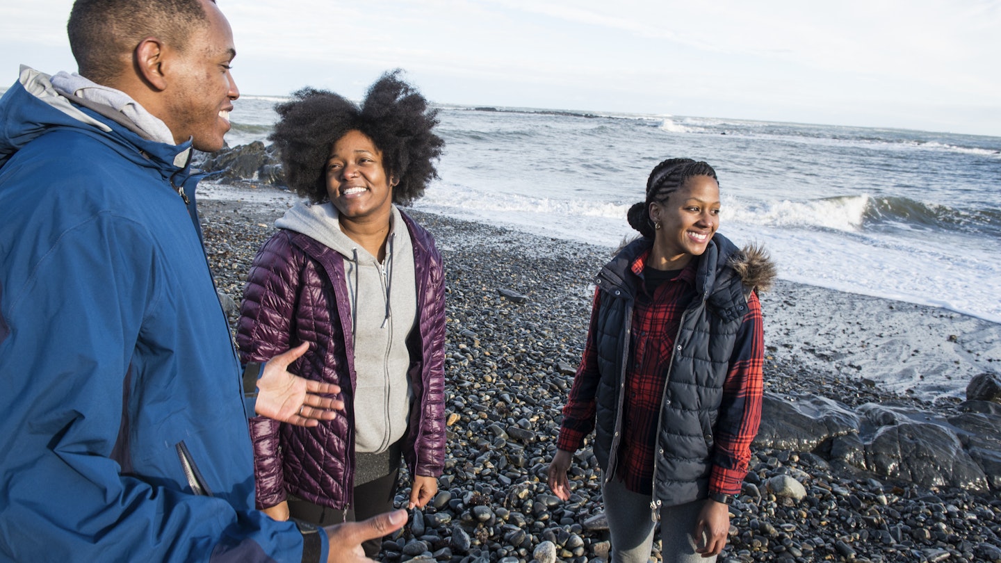 Three smiling African American people standing on gravel beach and talking
1011210070
african american, african american ethnicity, black, conquer, help, helping, helping hand, overcoming, sunshine
Three people standing on a gravel beach and talking in Maine