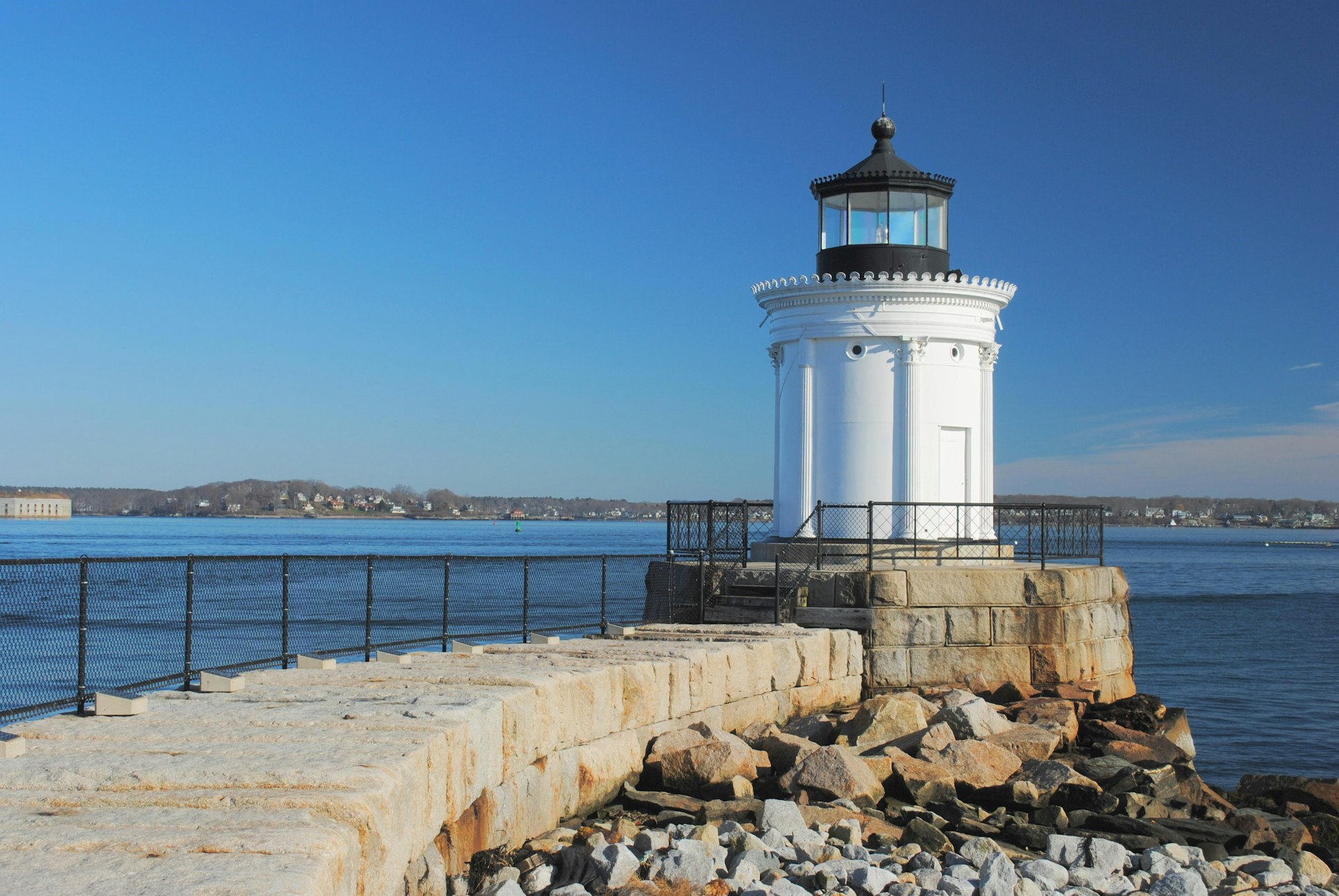 The Portland Breakwater Lighthouse in Maine with blue sky behind it