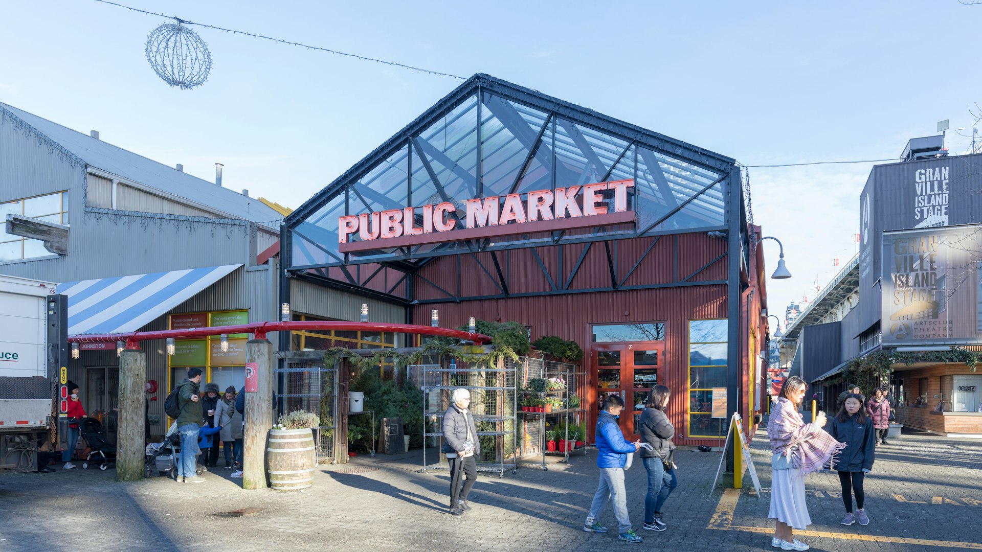 The exterior of Granville Island Public Market in Vancouver, home to over 100 vendors offering fresh seafood, meats, sweets and European specialty foods.