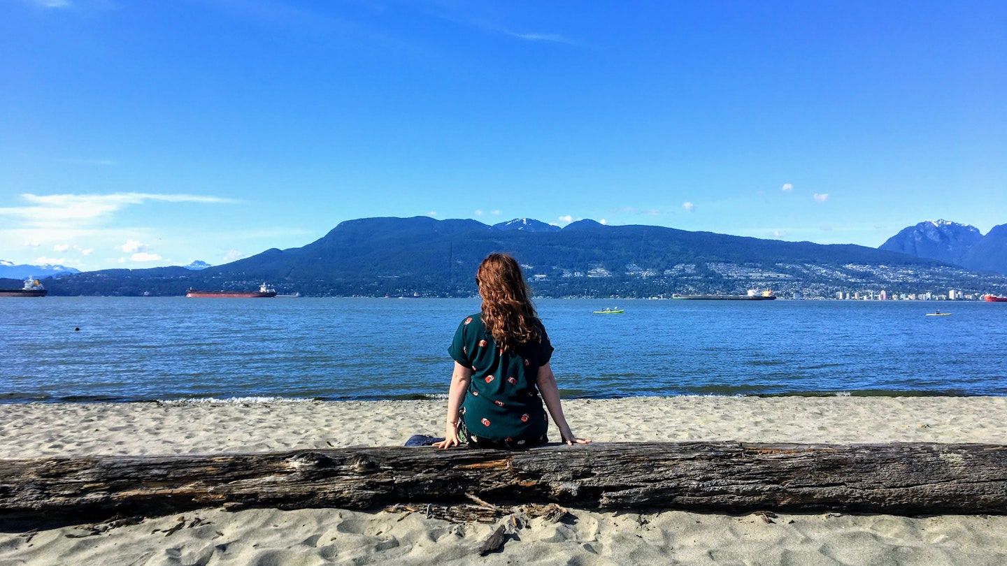 A from behind view of a beautiful young woman sitting on a log on the beach on a beautiful sunny day, deep in thought staring out at the ocean and mountains in Vancouver, British Columbia, Canada.
1151069150
admiring, background, bay, beautiful, blue sky, coast, contemplating, deep in thought, female, from behind, girl, landscape, mountains, ocean, outdoor, person, perspective, pretty, thinking, vancouver, view, woman, young
