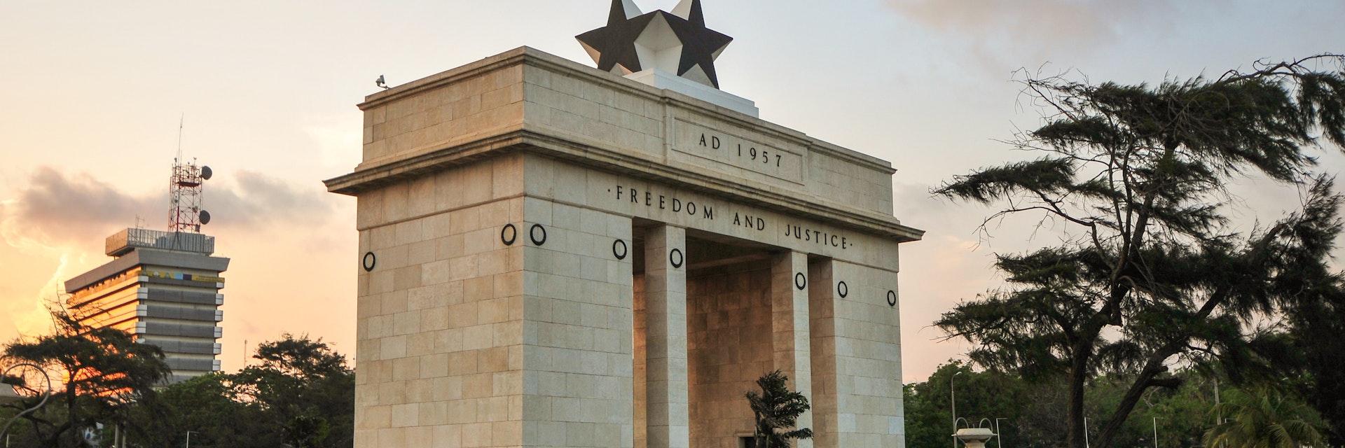 The Independence Square of Accra, Ghana, inscribed with the words "Freedom and Justice, AD 1957", commemorates the independence of Ghana, a first for Sub Saharan Africa. It contains monuments to Ghana's independence struggle, including the Independence Arch, Black Star Square, and the Liberation Day Monument.
453437701
1957, Accra, Africa, African Descent, Arch, Architecture, Black, Black Star, British Colony, Day, Dusk, East, Famous Place, Flag, Freedom, Ghana, Horizontal, Independence, Justice, Monument, Night, People, Side View, Square, Star, Star Shape, Stone, Struggle, Sunset, Town Square, Travel, colonialism, indepedence