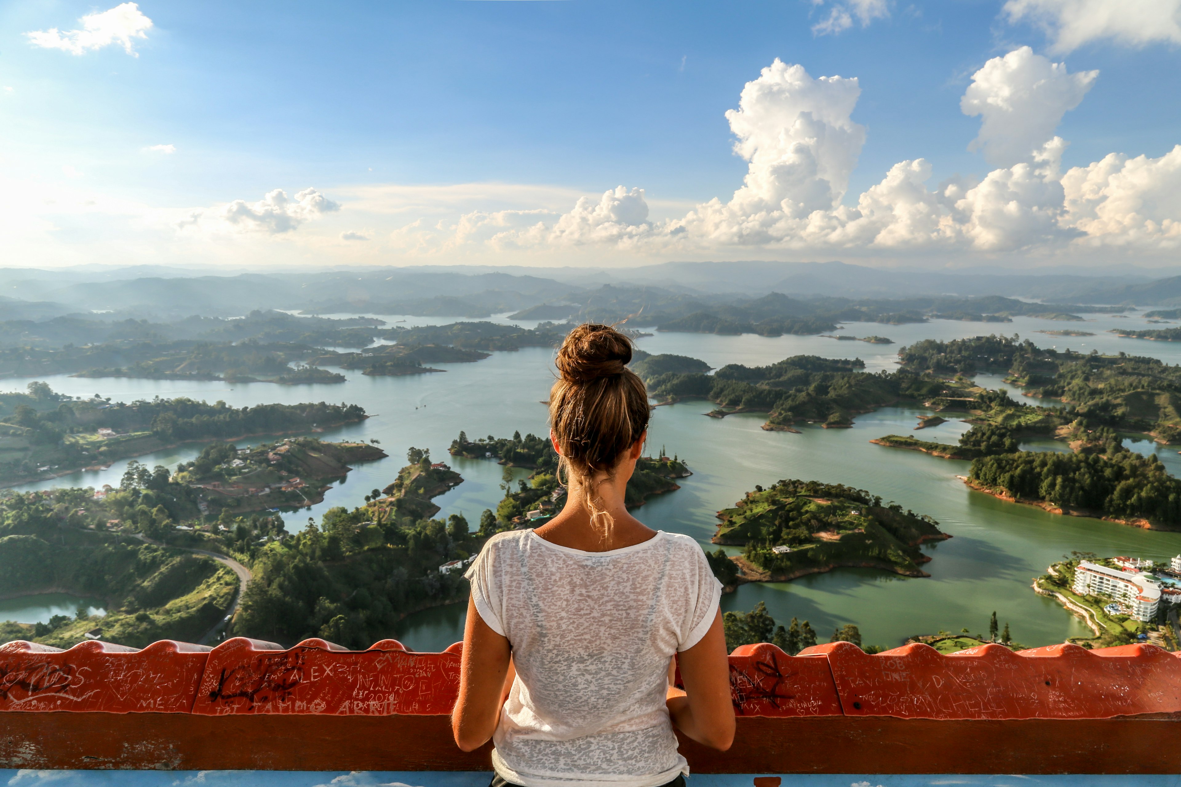 A girl looks over Guatape and the expansive lake system.