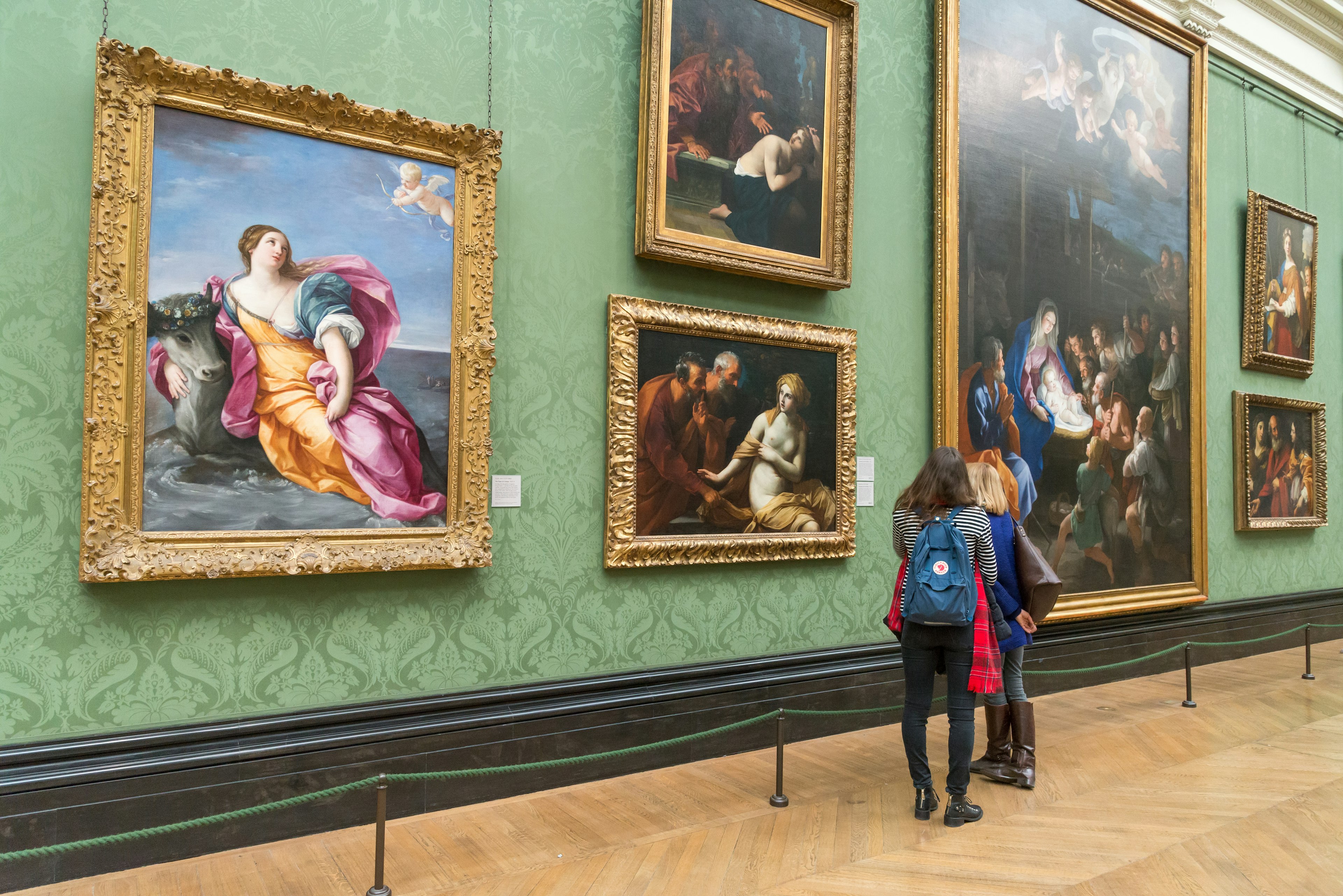 Admiring 17th-century Italian paintings in the Italy room of the National Gallery, London