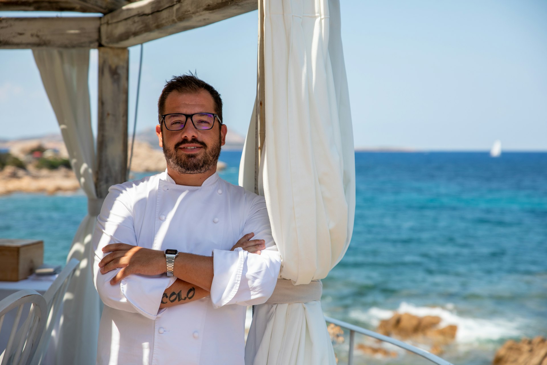 Somu’s head chef Salvatore Camedda, ocean background