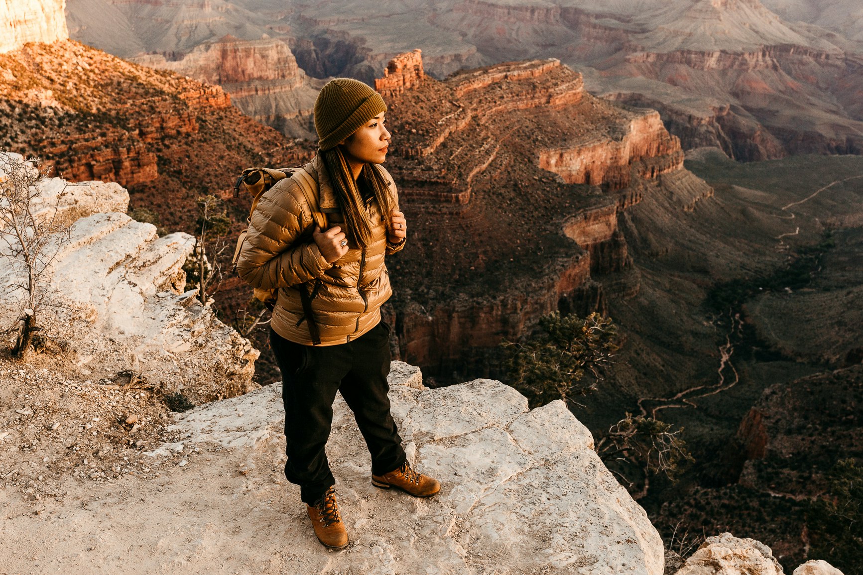 A woman looking out towards the Grand Canyon