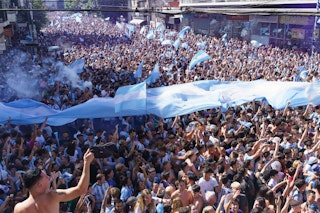 Buenos Aires, Argentina - December 18, 2022: Happy Argentine football fans celebrate winning a final football match at the Qatar 2022 FIFA World Cup.; Shutterstock ID 2240007849; your: Brian Healy; gl: 65050; netsuite: Lonely Planet Online Editorial; full: Best time to visit Buenos Aires
2240007849
2022, argentina, argentine, argentinian, buenos aires, celebrating, celebration, champion, championship, cheerful, cheering, city, crowd, culture, cup, event, face, fan, fans, fashion, festival, fifa, fifa world cup, final, flag, football, fun, game, group, happy, holidays, man, match, messi, national, person, player, qatar, soccer, sport, stadium, street, team, travel, uniform, victory, win, woman, world