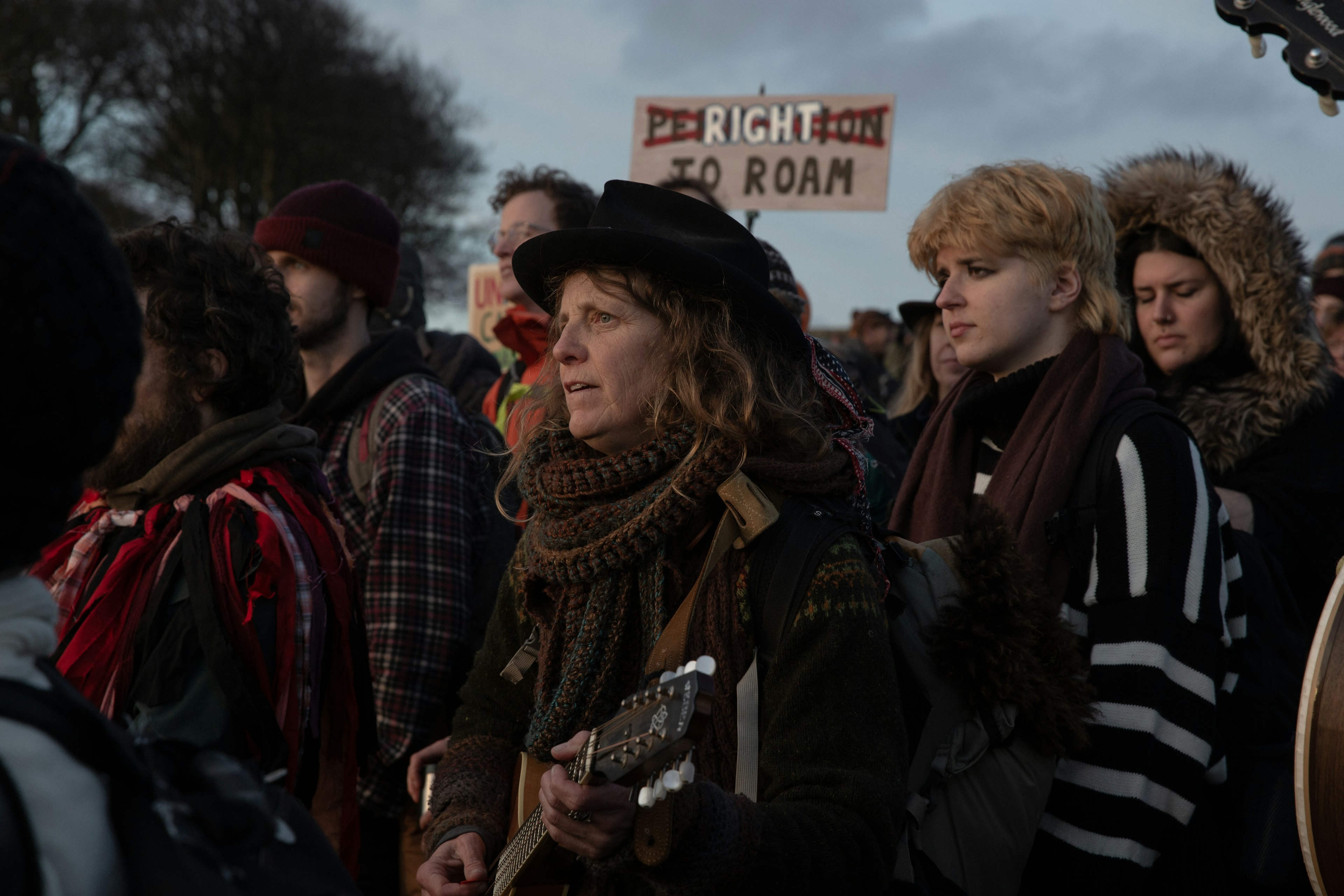 People gather together at a protest for the right to roam.