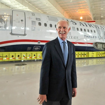 Capt. Chesley Sullenberger, stands in front of the US Airways flight 1549 fuselage at the Carolinas Aviation Museum where he and other crew members met with passengers to recall their memorable water landing in the Hudson River and to celebrate the plane's arrival at the museum.