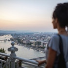 Woman looking at Budapest at sunset
1160640166
