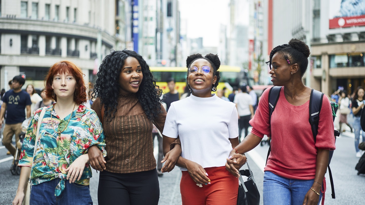 Multi nationality women walking through Tokyo