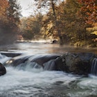 A fisherman stands in the background of an autumn scene with mist still floating on the river and water flowing over rocks in the foreground.
177497512
"Morning, Autumn, Beauty In Nature, Boulder, Fisherman, Fishing, Forest, Great Smoky Mountains National Park, Landscape, Mist, Nature, Nature, People, River, Scenics, Sports And Fitness, Tennessee, USA, Water, Water", Woods