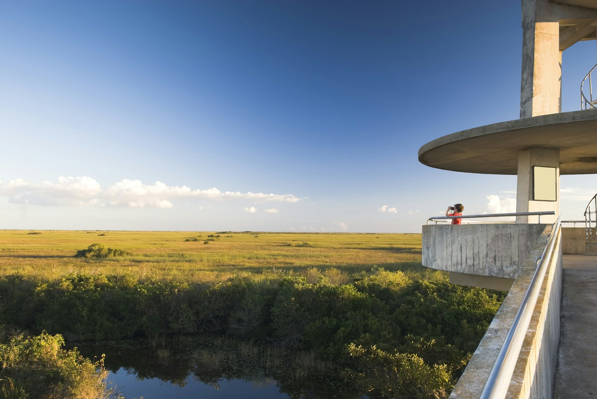 A boy looks out from the Shark Valley Observation Tower, Everglades National Park, Florida, USA