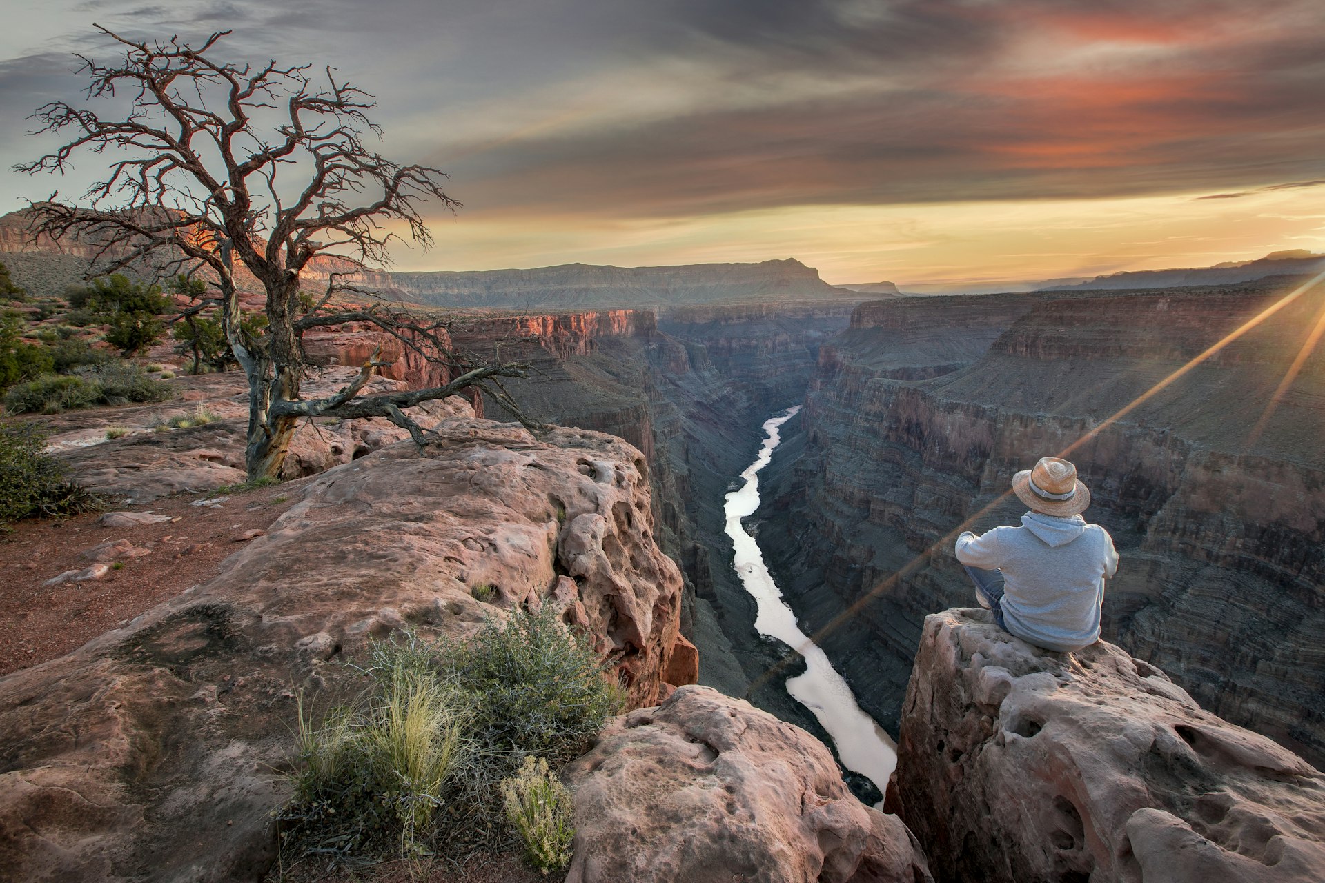 Man viewing Grand Canyon at sunrise
