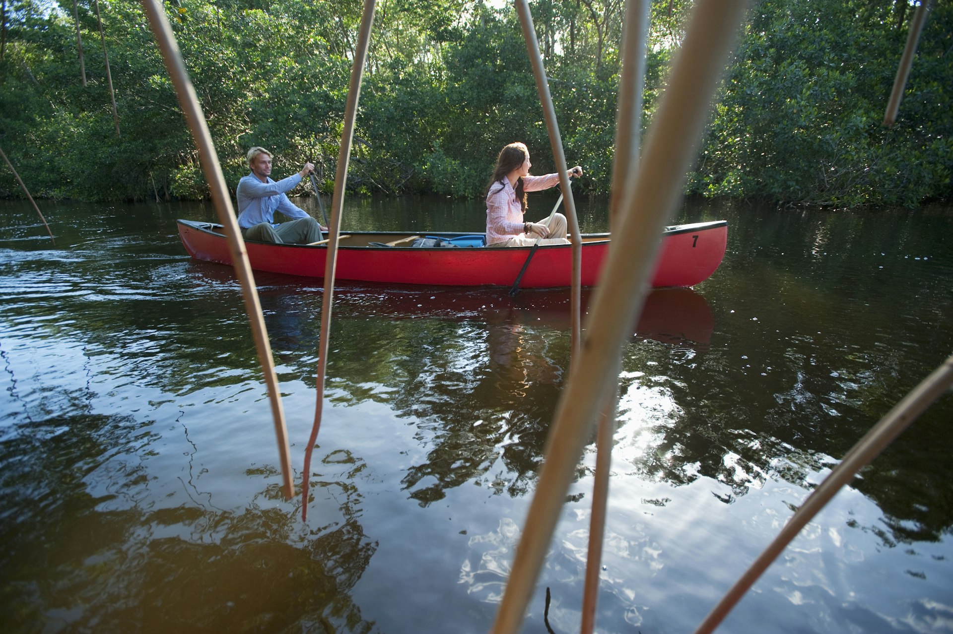 Couple paddling a canoe in Everglades National Park.