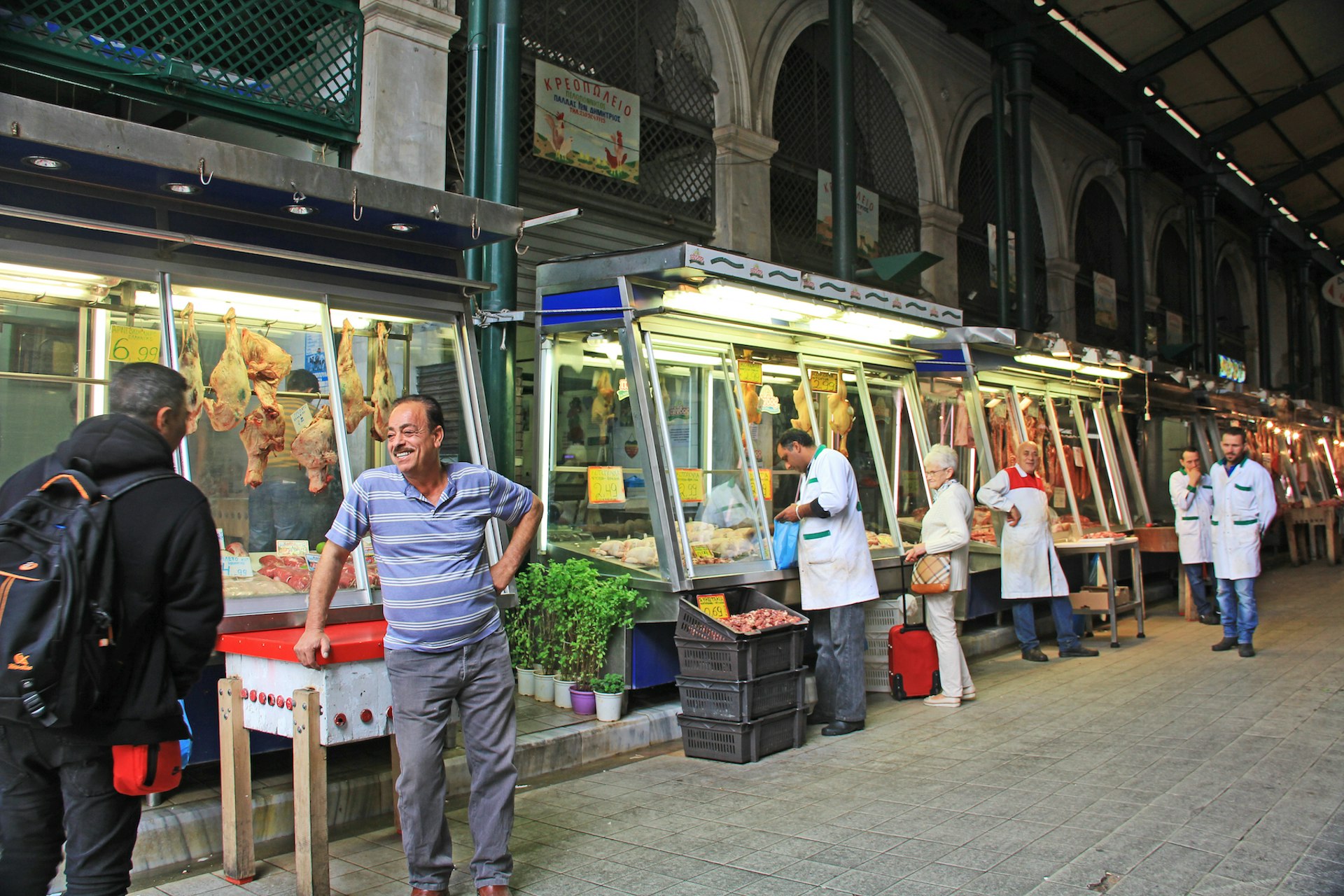 Shoppers and vendors at Varvakios Agora, the central meat and fish market, Athens, Greece