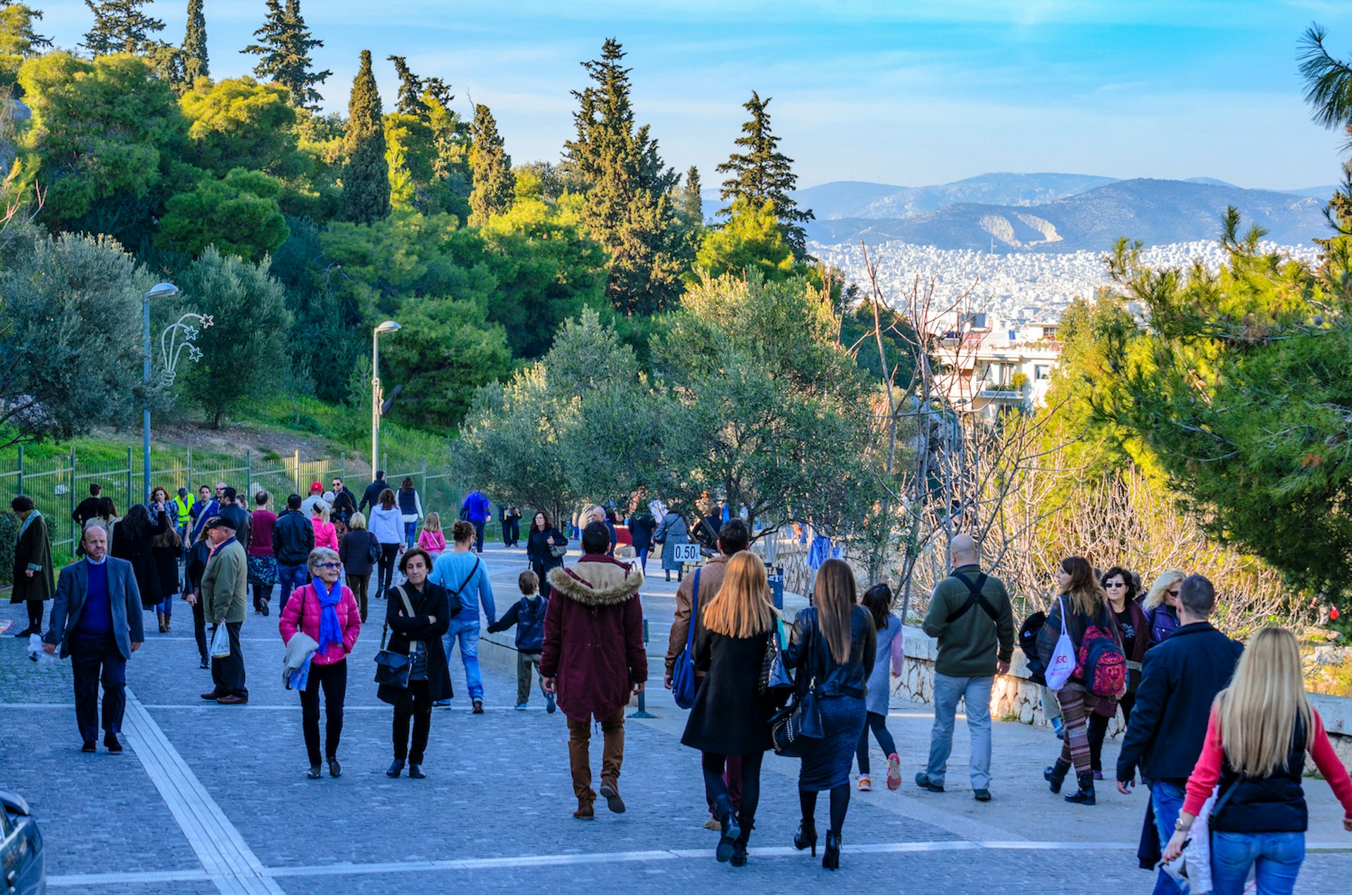 Crowds of people walking on the pedestrian Dionysiou Areopagitou Street, Athens, Greece