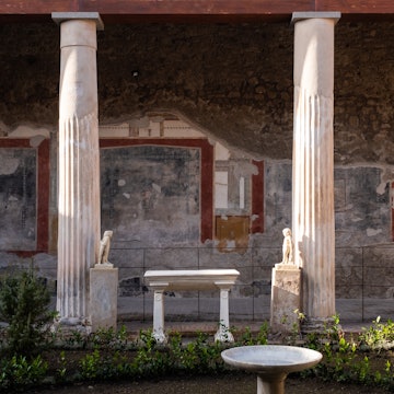 NAPLES, ITALY - JANUARY 10: The Peristyle of the domus House of the Vettii at the Archaeological Park of Pompeii, during the inauguration day of the reopening of the House of the Vettii, January 10, 2023. The House of the Vettii is a domus from Roman times, buried during the eruption of Vesuvius in 79 and found as a result of the archaeological excavations in ancient Pompeii. It represents one of the finest examples of 1st century Roman art and is so named after its owners, Aulus Vettius Restituto and Aulus Vettius Conviva, reopening to the public after 20 years, after a restoration project, undertaken in 2016 under the direction of Massimo Osanna, has drawn on the collaboration of a wide range of professionals, including archaeologists, architects, restorers, engineers, structural engineers and gardening experts, making it one of the most complex projects in the panorama of archaeological heritage in recent decades. (Photo by Stringer/Anadolu Agency via Getty Images)
1246130579
archaeological park of pompeii, archeology, complex, culture, domus, home, house of the vettii, naples, park, roman times, vettii, view