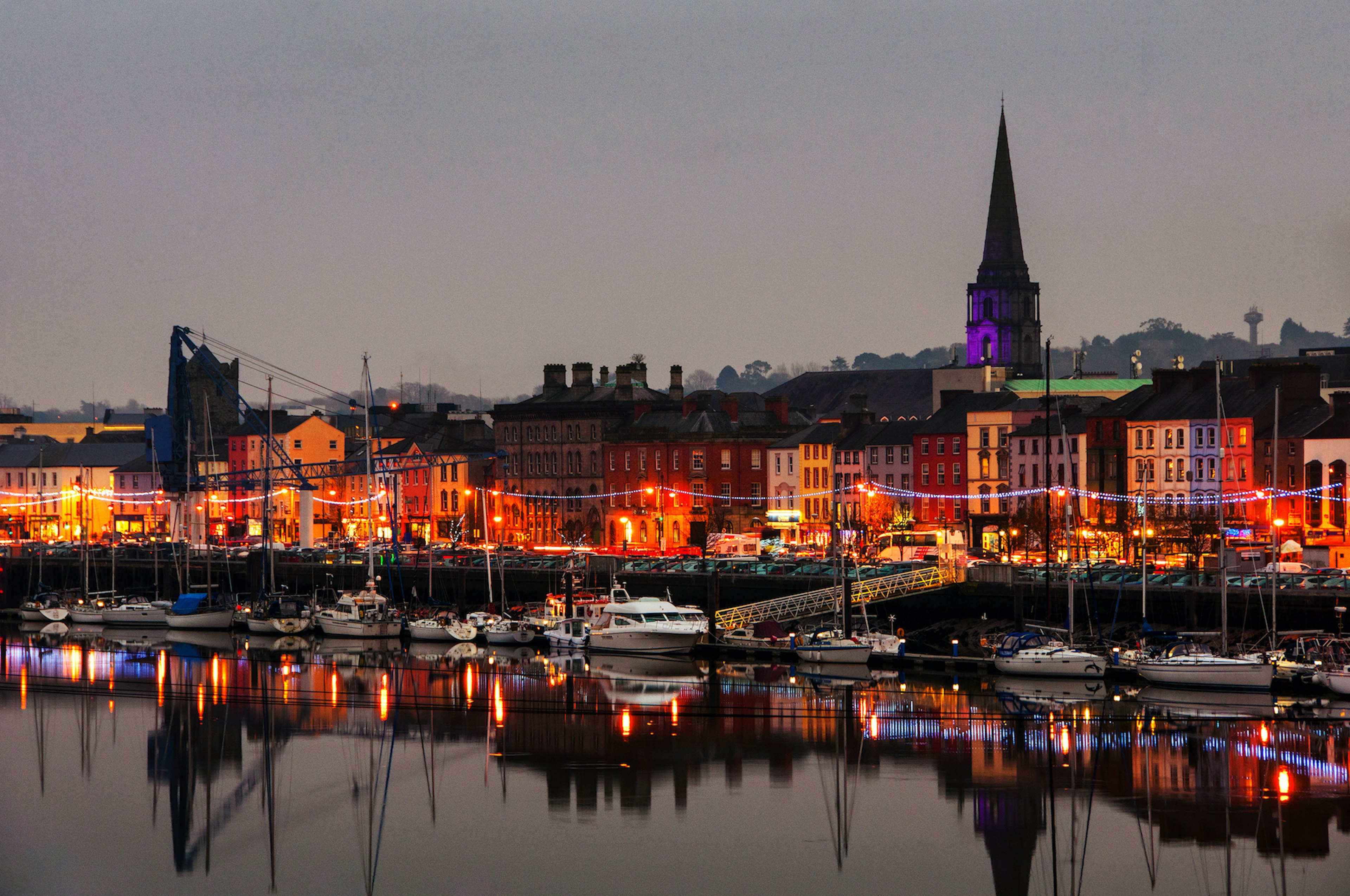 Panoramic view of a cityscape and harbor at night with illumination in Waterford, County Waterford, Ireland