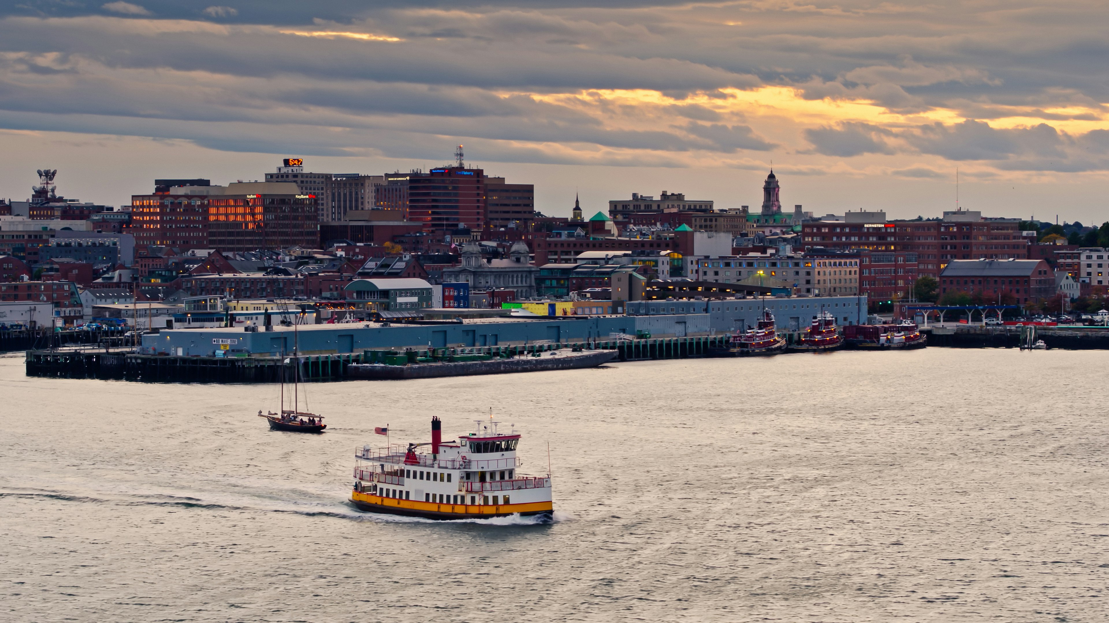 Aerial view of Old Harbor and Waterfront districts in Portland, Maine at sunset.