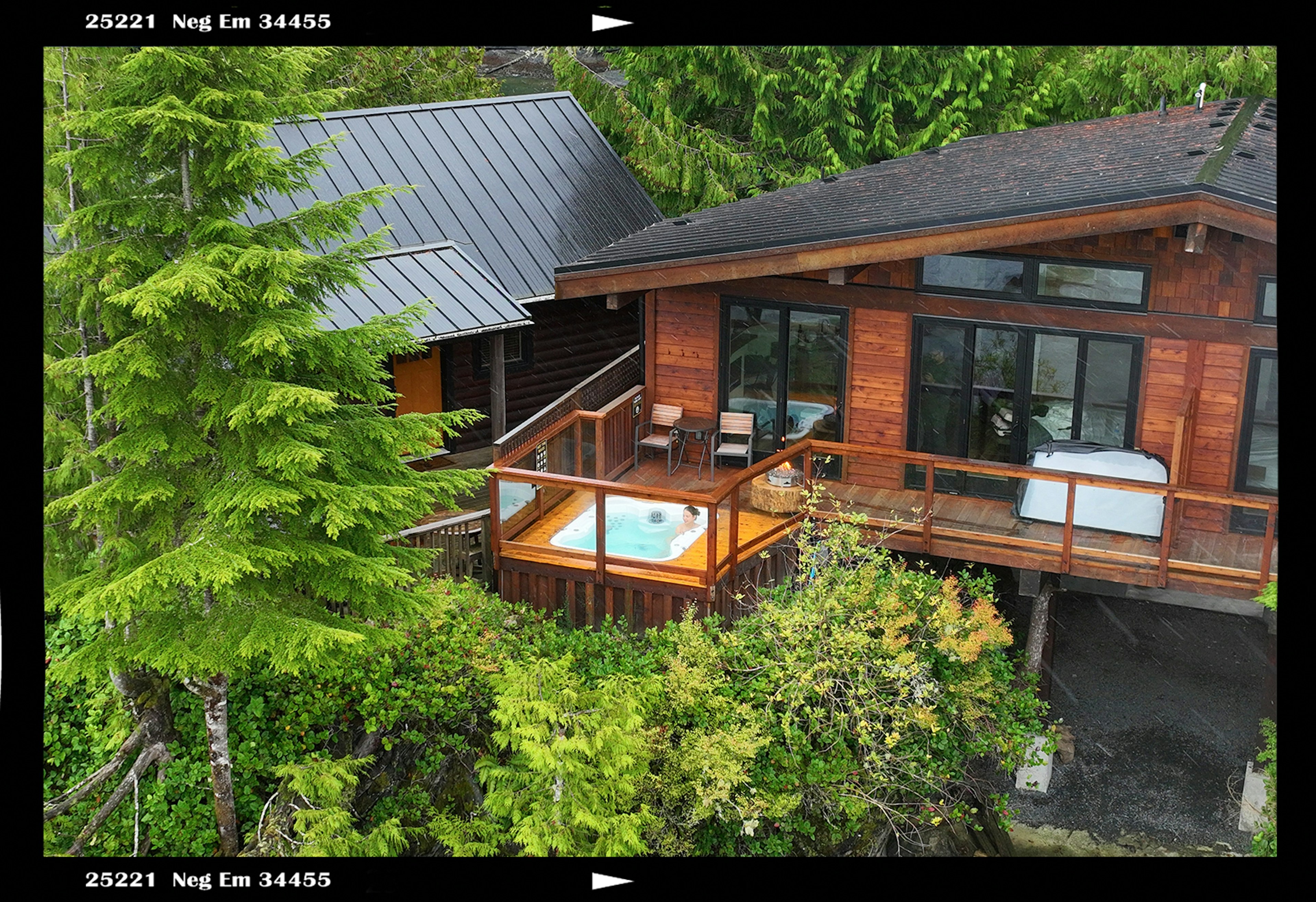 Hot tub on the deck of a wooden lodge