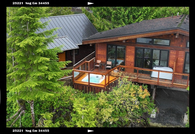 Hot tub on the deck of a wooden lodge