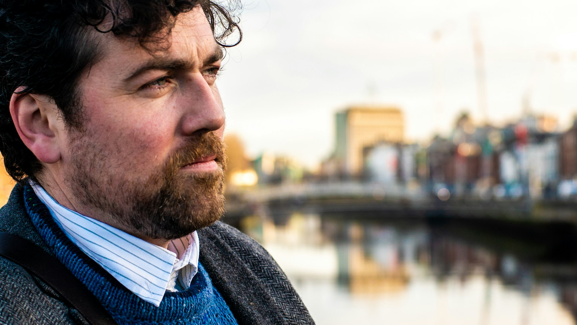 Close-up shot of tour guide and ballad singer Seán Fitzgerald on the River Liffey, Dublin, Ireland
