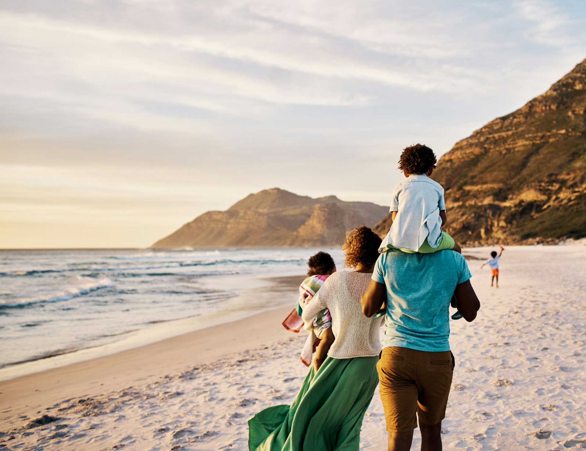 A family walking on a beach in South Africa