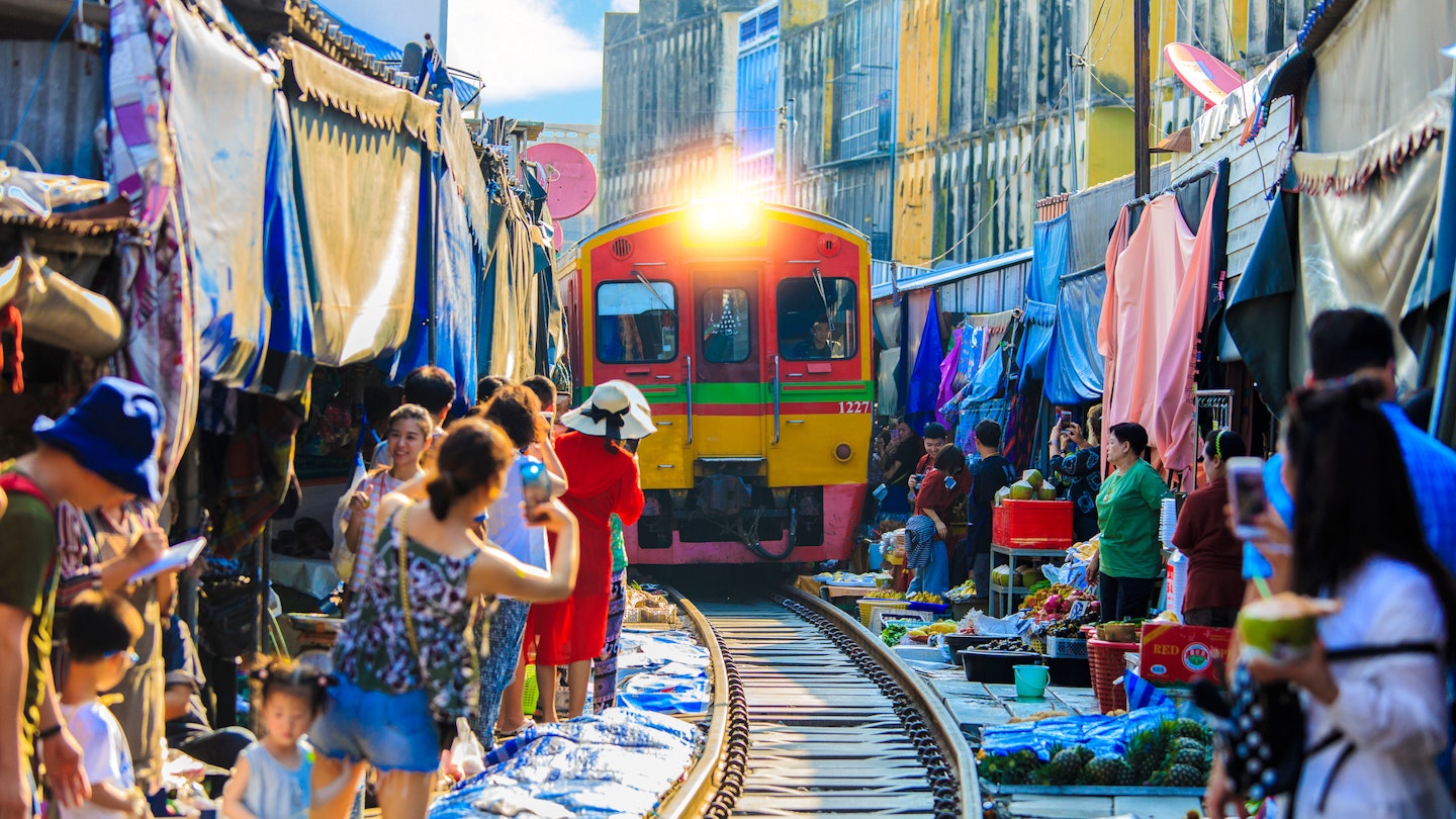 Samut Songkhram, Thailand - April 3, 2019 :The famous Maeklong Railway Market (aka. Talad Rom Hub), all vendors have to move product away when the train passes market at Samut Songkhram, Thailand; Shutterstock ID 1424576555; your: Brian Healy; gl: 65050; netsuite: Lonely Planet Online Editorial; full: Help Me LP: Best day trips from Bangkok
1424576555
ancient, asia, asian, building, business, china, chinese, city, color, colorful, crowd, culture, famous, food, historic, history, landmark, light, market, night, old, outdoor, people, railroad, railway, road, samut songkhram, shop, store, street, thai, thailand, tourism, tourist, town, track, traditional, train, transport, transportation, travel, umbrella, urban