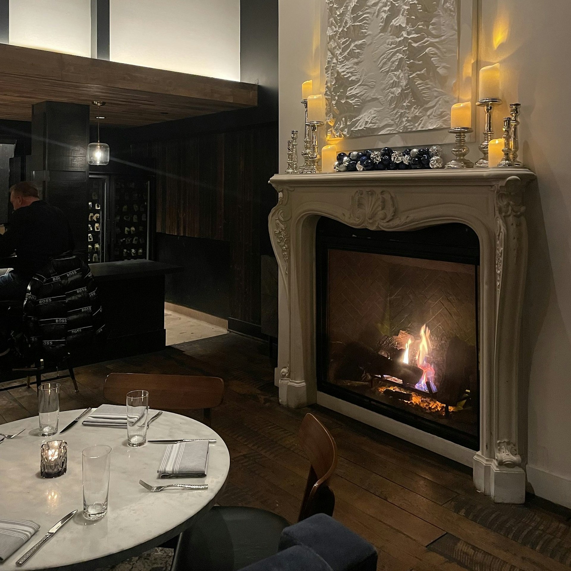 Fireplace and table at The Slope Room, Vail, Colorado, USA