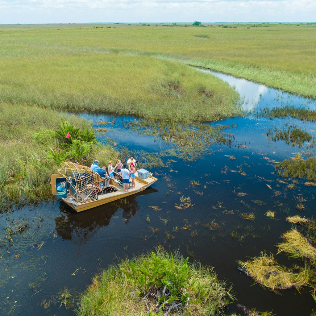 JULY 2019: Airboat tour takes a break in the Everglades National Park.
1455694103
airboat, airboat everglades, alligator, alligator head, american alligator, animal, animals, big cypress, big cypress national preserve, crocodile, everglades aerial, everglades airboat, everglades florida, florida, grass, green, miami, national park, nature, nature landscape, park, shark valley, summer, swamp background, swamp grass, swamp trees, swamp water, swamps, tourism, travel, wildlife