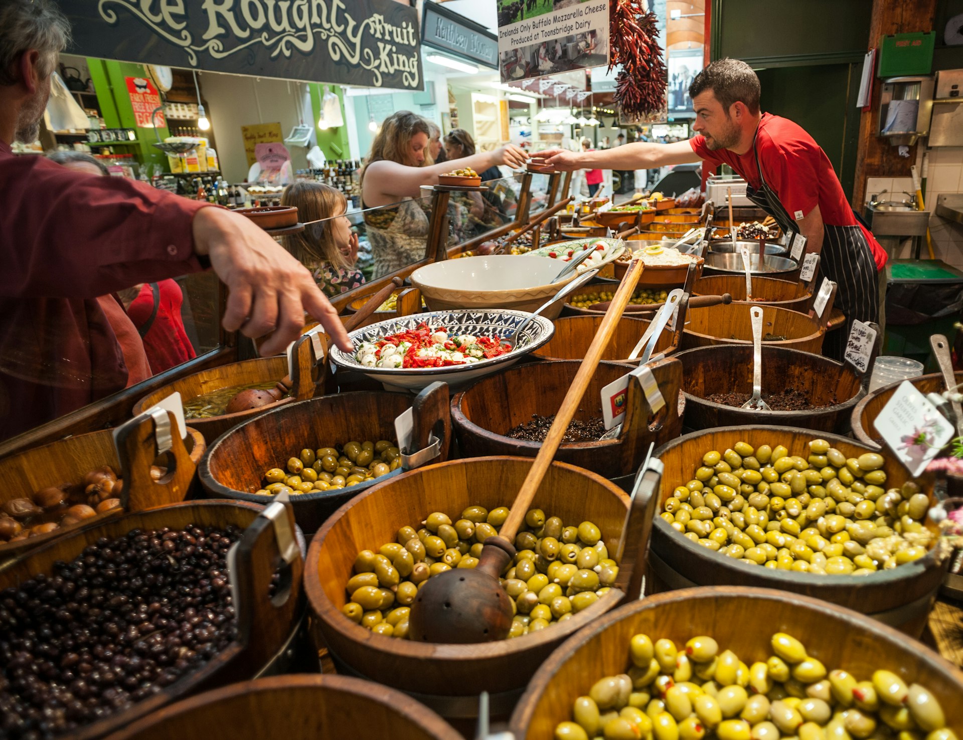 People shopping for olives in the English Market in Cork City, County Cork, Ireland