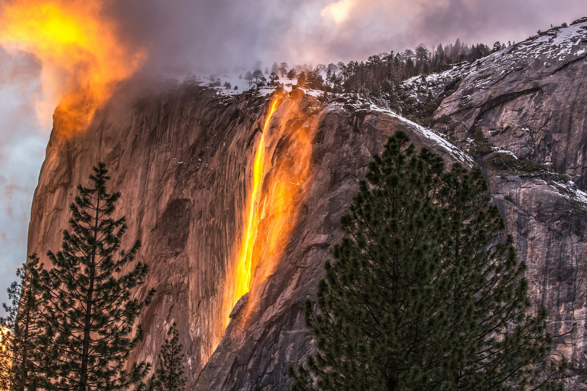 Yosemite's Horsetail Falls, illuminated by the setting sun so the water appears to be flowing lava