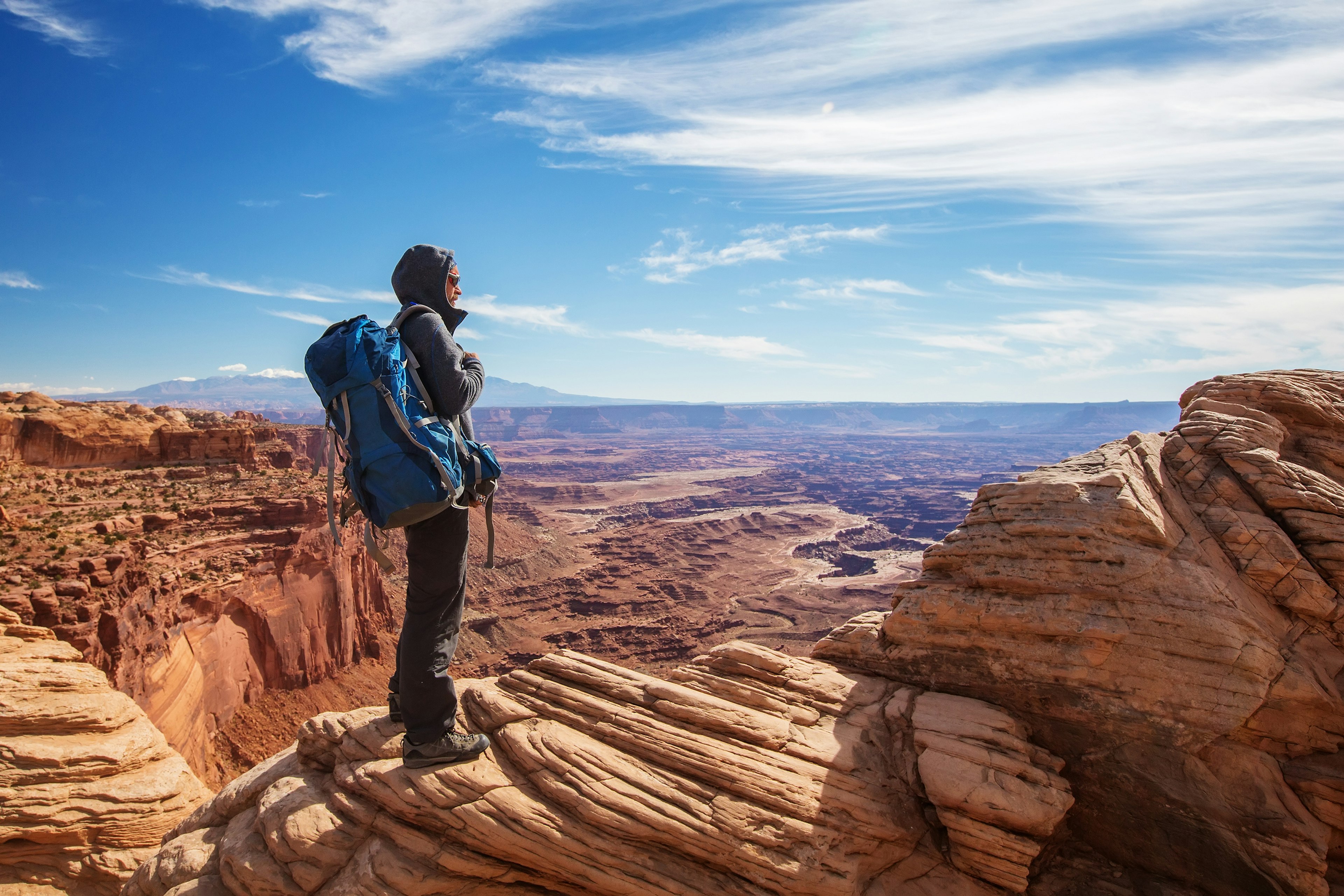 Hiker in Canyonlands National park in Utah, USA; Shutterstock ID 1234931752; your: Melissa/Yeager; gl: 65050; netsuite: Online Editorial; full: Friday around the planet May 20