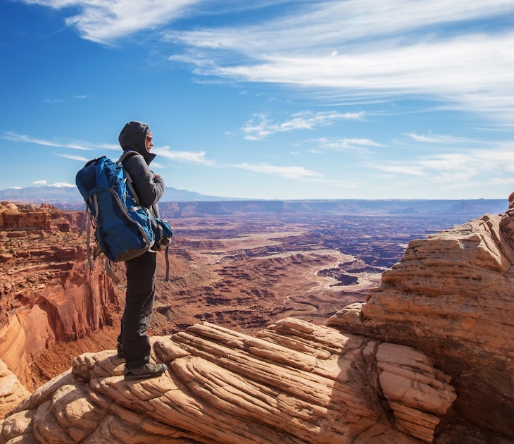 Hiker in Canyonlands National park in Utah, USA; Shutterstock ID 1234931752; your: Melissa/Yeager; gl: 65050; netsuite: Online Editorial; full: Friday around the planet May 20