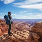 Hiker in Canyonlands National park in Utah, USA; Shutterstock ID 1234931752; your: Melissa/Yeager; gl: 65050; netsuite: Online Editorial; full: Friday around the planet May 20