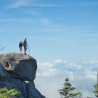 Above the clouds. Father and son on a rock in the National Park Great Smoky Mountains; Shutterstock ID 146553860; your: Claire Naylor; gl: 65050; netsuite: Online Ed; full: Great Smokey Mountains NP things to do
146553860