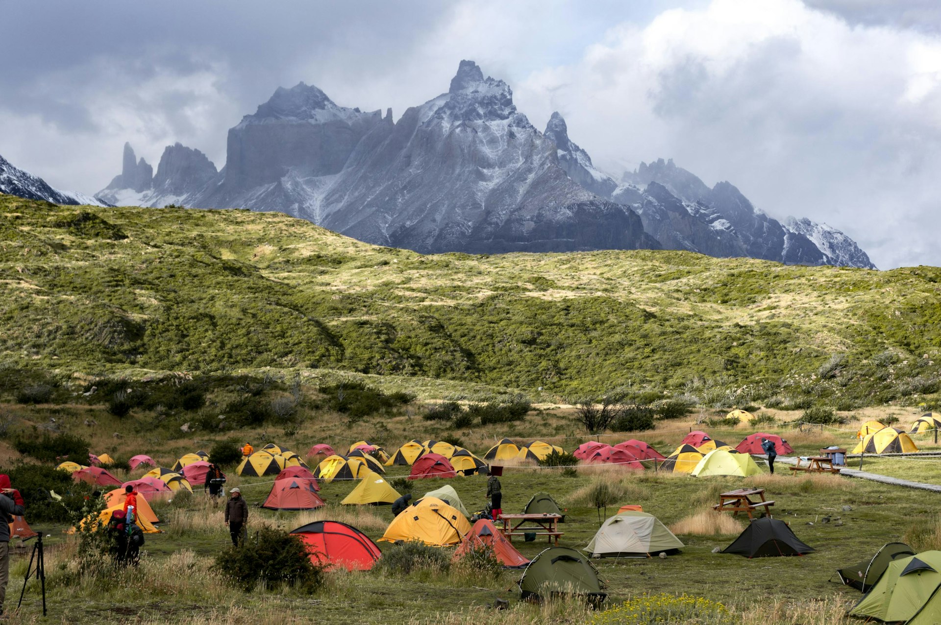 Tents with mountains in the distance at Torres del Paine National Park, Patagonia, Chile