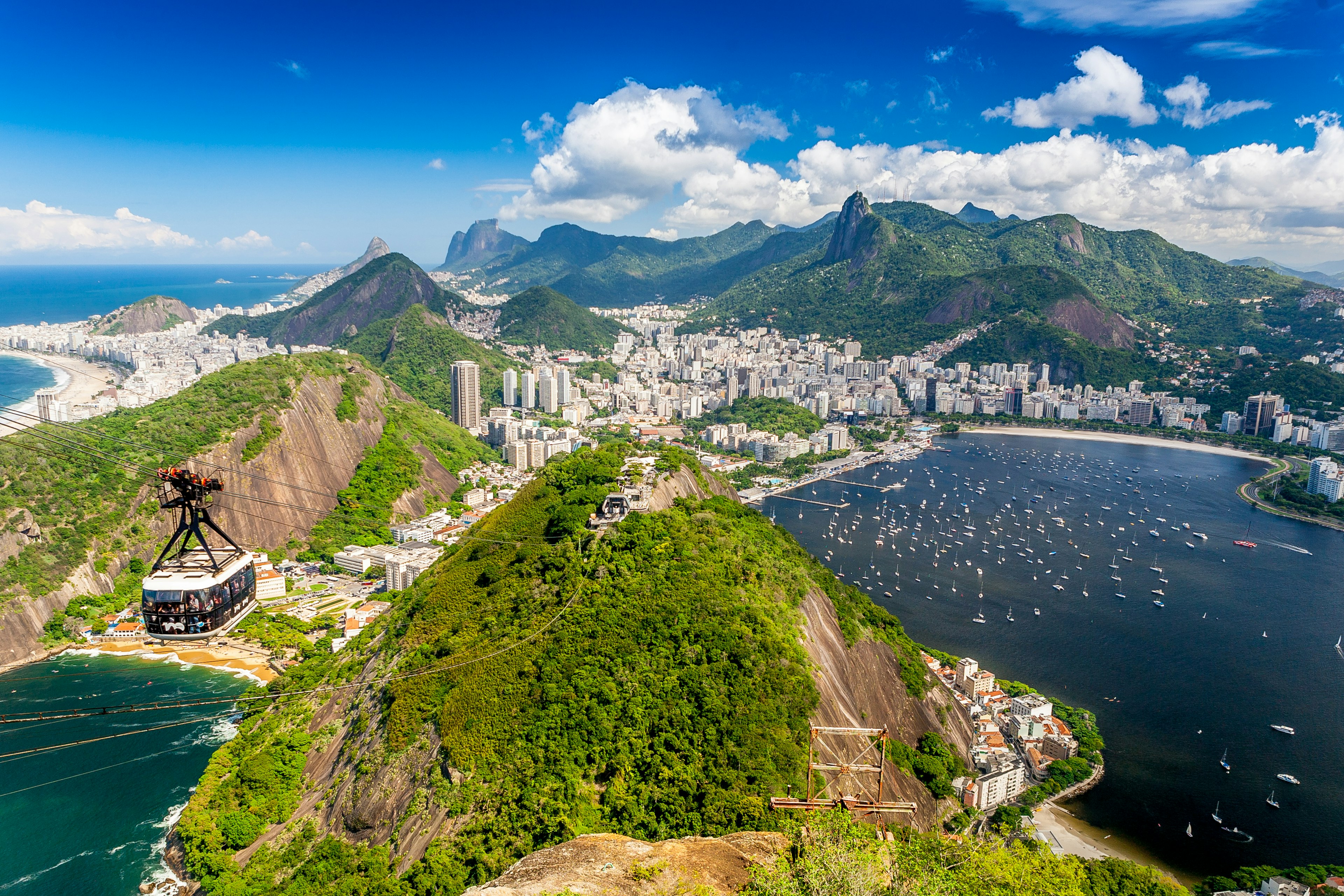 Mountaintop views over a coastal city with many bays