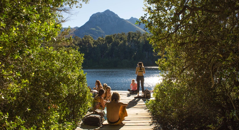 LAGO ESCONDIDO, BARILOCHE - ARGENTINA - FEBRUARY 2017 - Unidentified young people, enjoying the summer on the patagonian lake, eating and having fun on the deck.; Shutterstock ID 653309122; your: Sloane Tucker; gl: 65050; netsuite: Online Editorial; full: Bariloche Landing Page 653309122