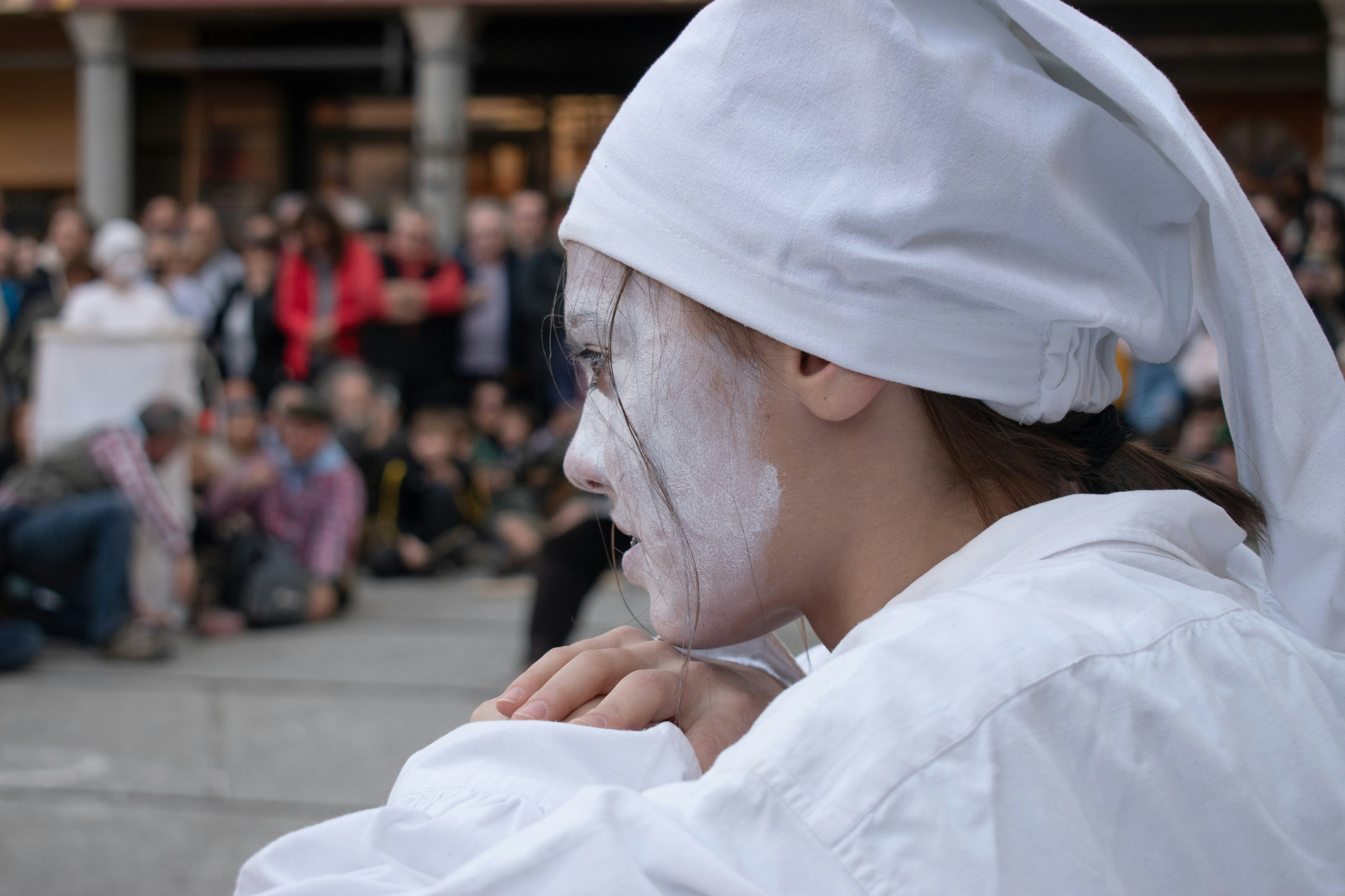 Catalan Bear Festival woman dressed as traditional baker with flour on face