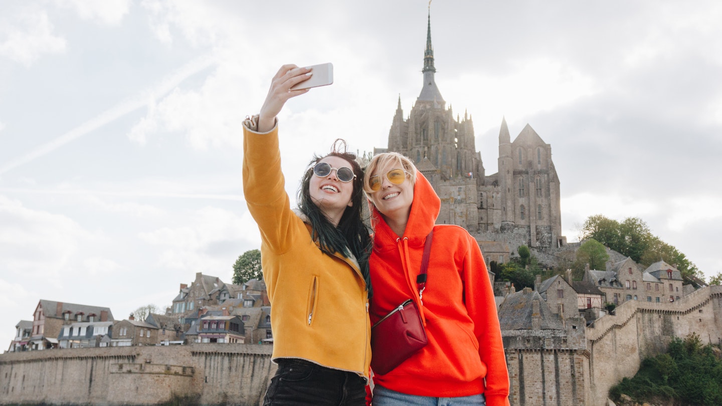 beautiful girls taking selfie on smartphone near Saint michaels mount, Normandy, France
1008393588
digital device, using, red hoodie, saint michaels mount