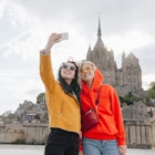 beautiful girls taking selfie on smartphone near Saint michaels mount, Normandy, France
1008393588
digital device, using, red hoodie, saint michaels mount
