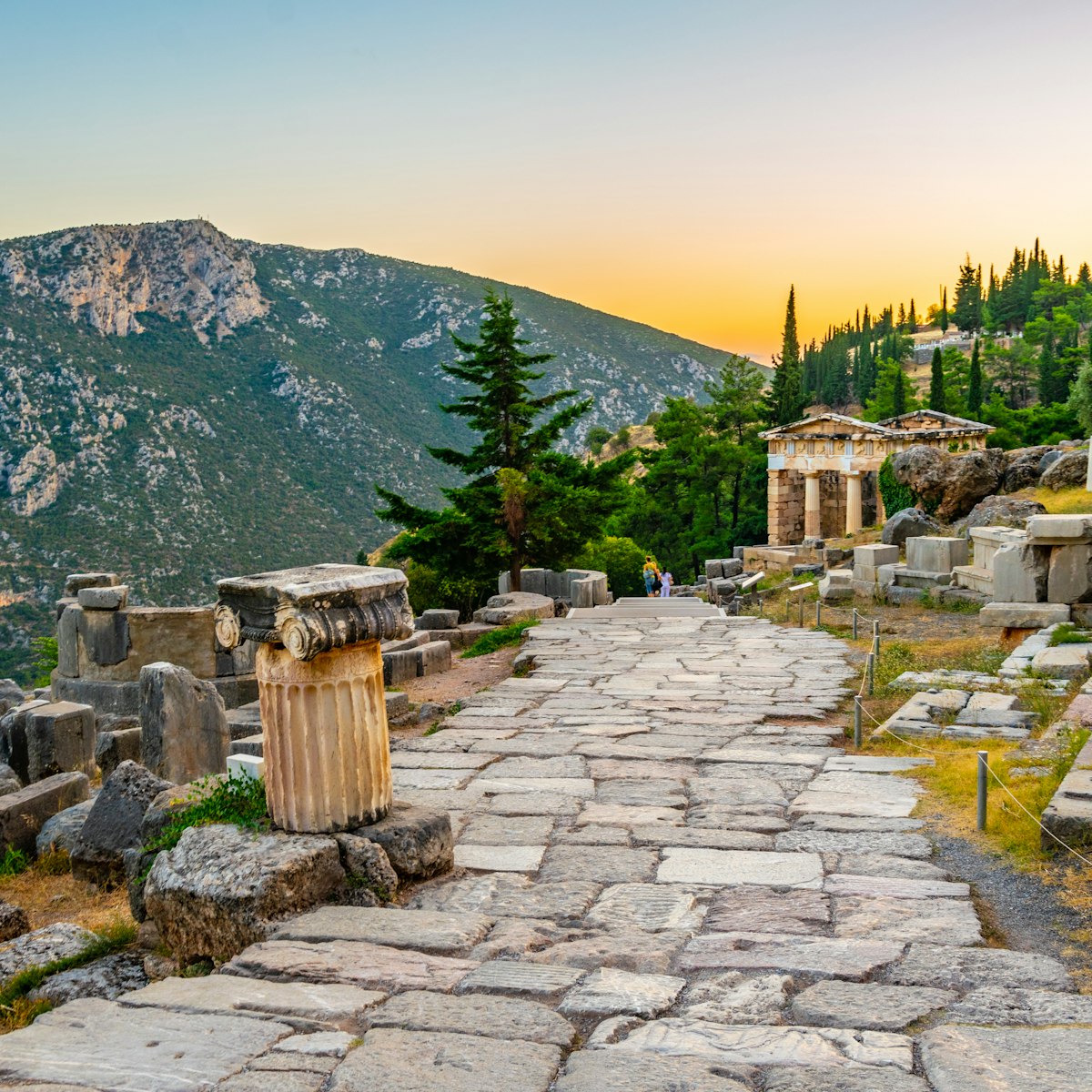 Sunset view of Athenian treasury at the ancient delphi site in Greece