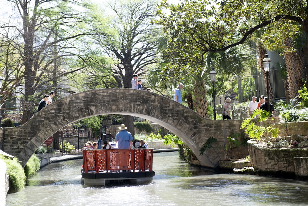 San Antonio, USA - March 14, 2019. Tourists riding in tour boat with others walking along River Walk in downtown San Antonio, Texas, USA
1158409726
Tourists riding in tour boat with others walking along River Walk in downtown San Antonio - stock photo
San Antonio, USA - March 14, 2019. Tourists riding in tour boat with others walking along River Walk in downtown San Antonio, Texas, USA