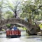 San Antonio, USA - March 14, 2019. Tourists riding in tour boat with others walking along River Walk in downtown San Antonio, Texas, USA
1158409726
Tourists riding in tour boat with others walking along River Walk in downtown San Antonio - stock photo
San Antonio, USA - March 14, 2019. Tourists riding in tour boat with others walking along River Walk in downtown San Antonio, Texas, USA