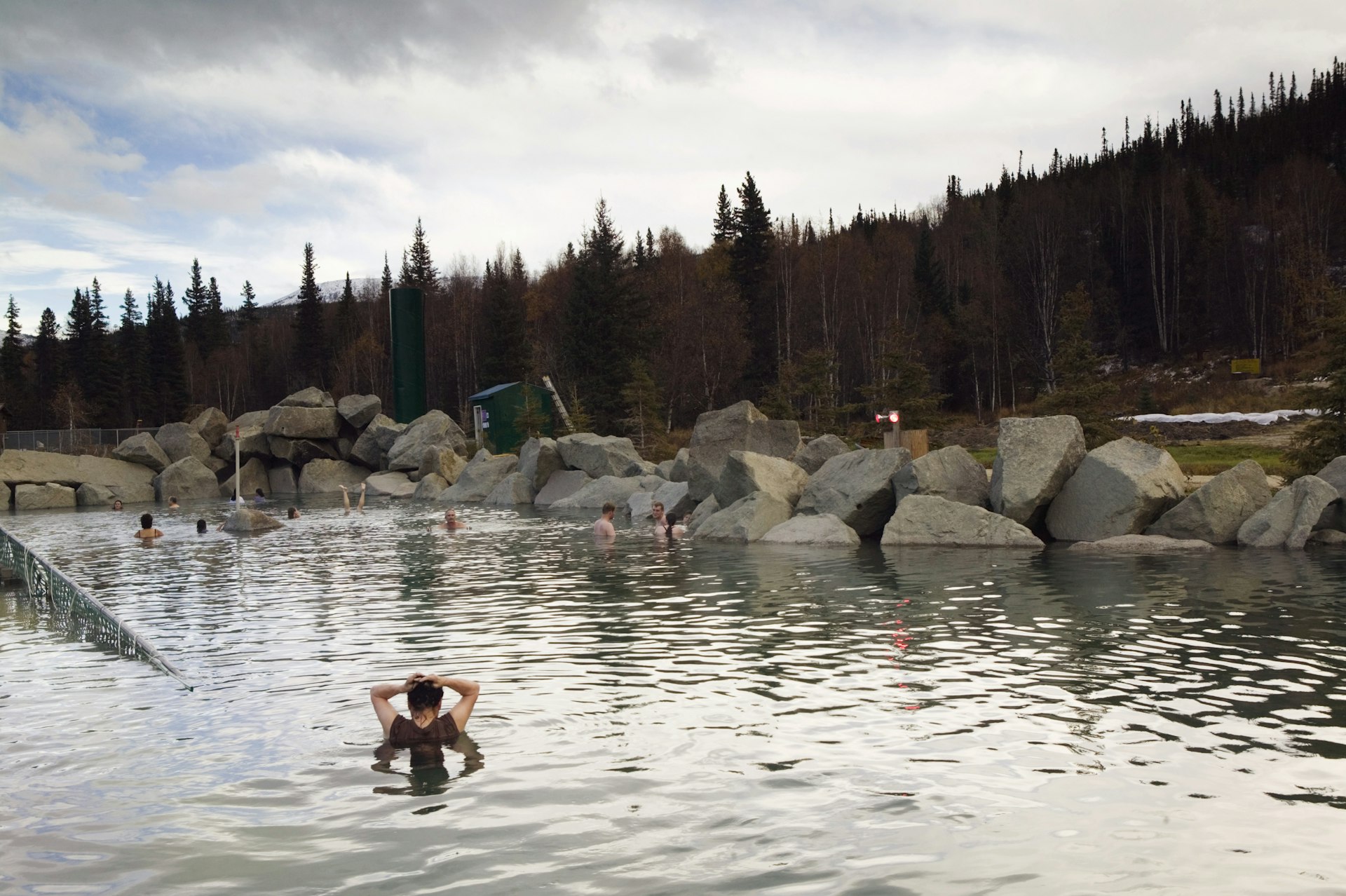 People soak in the naturally heated pools of Chena Hot Springs, Alaska