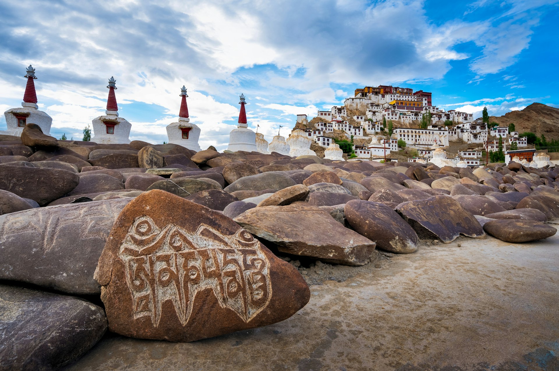 View of Thikse Monastery and prayer rocks in Ladakh India