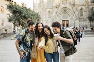 Small group of multiracial young tourists taking a selfie in front of the Barcelona's cathedral. Catalonia. Spain
1385464195